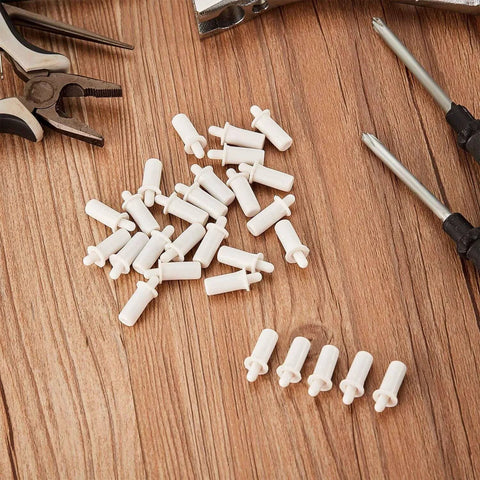 40 Pieces Shutter Repair Pins, Plantation Shutter Fasteners Spring Loaded Replacement Repair Pins, white pins on wood surface.