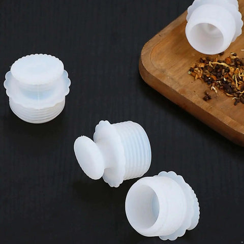 White Silicone Spiral Screw Thermal Sealed Stopper For Home Vacuum Flasks And Water Bottles Durable Reusable Bottle Plug On Black Surface