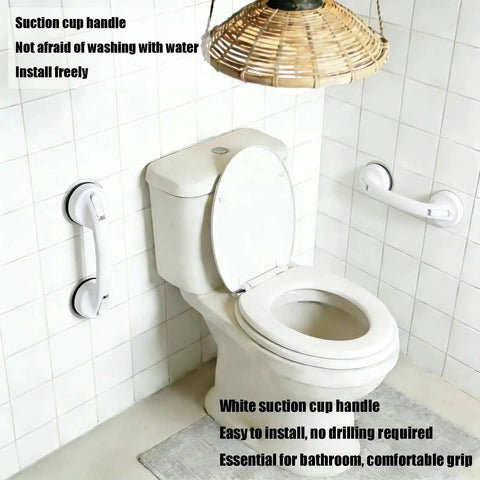 White strong suction cup handle no drilling installation in bathroom, shown on tile wall beside toilet, tool-free and stable.