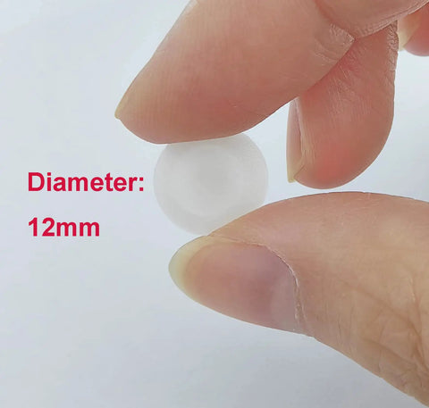 Close-up of a hand holding a 12mm white waterproof plastic cap, part of 50 Pieces Waterproof Plastic Self Tapping Caps for Phillips Screw Heads.