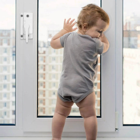 Toddler standing against a window with 10 Pack Sliding Window Sash Locks Cam Action White For Vertical And Horizontal Sliding Windows Double Hung Window Sash Lock Set Left Or Right Opening Enhances Security And Prevents Forced Entry installed for security.