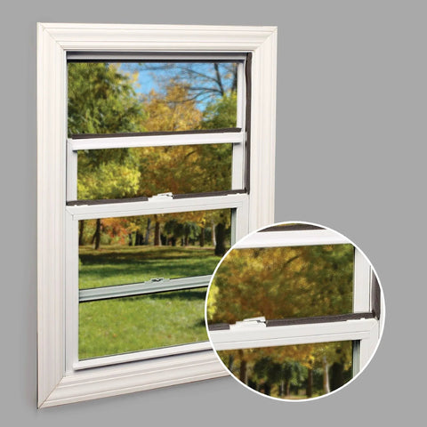 Window with self-stick rubber foam weatherseal, 3/8"W, 3/16"T, black, installed to prevent drafts with outdoor view.