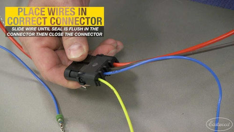 Hand installing wires into connector using Crimp Right Weather Tight Connector Crimping Kit Ferrule Crimper Plier Wire Stripper And Connectors Terminal Crimp Tool Kit For Wiring Projects And Electrical Repairs Ideal For Serious Automotive DIYers.