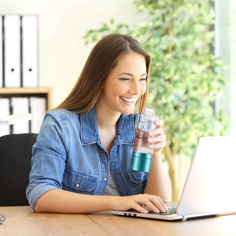 Woman using Hydrogen Water Bottle Generator For Enhanced Hydration At Home Or On The Go Dual Chamber SPE PEM Technology