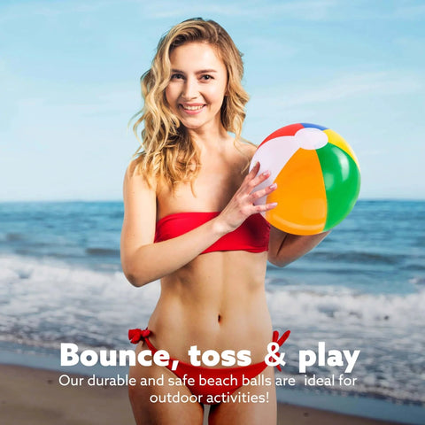 Woman holding a rainbow inflatable beach ball from the 12-Pack 12“ Beach Balls - Bulk Classic Beachball Inflatable Swimming Pool Toys set on the beach.