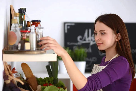 Woman using Two Tier Acacia Wood Lazy Susan Organizer for Kitchen Cabinet or Pantry Turntable Keeps Spices Condiments Within Reach