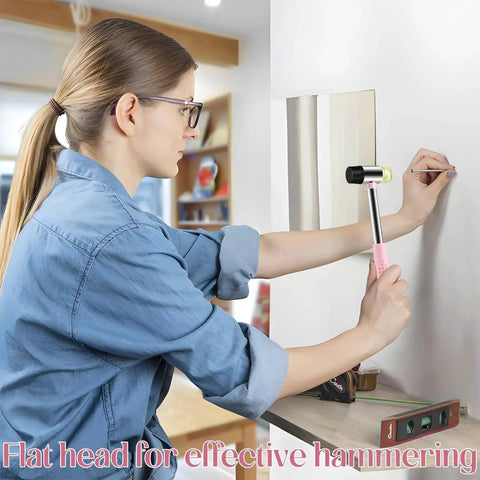 Woman using lightweight 8oz hammer set with a small claw hammer and 25 mm rubber mallet in pink for home repairs