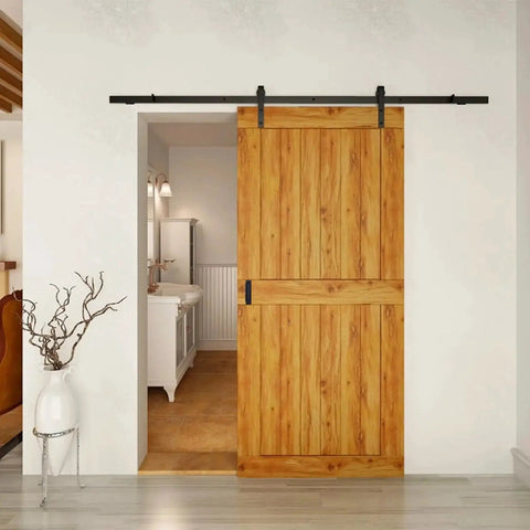 Wooden barn door with black hardware installed in a modern interior setting, showcasing use for Recessed Finger Flush Pulls 6 Inch Aluminum Rust Proof.