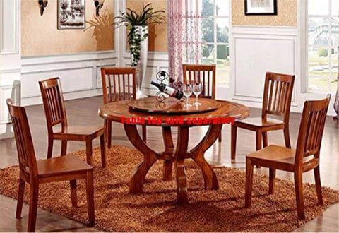 Wooden dining table set with round tabletop and six matching chairs, wine and glasses displayed, in a warmly lit dining room setting.