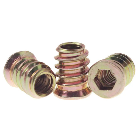Close-up view of 50 Pack Quarter Inch By Twenty Threaded Wood Inserts For Furniture And DIY Projects, Screw In Nutserts With Hex Drive, 15mm Length