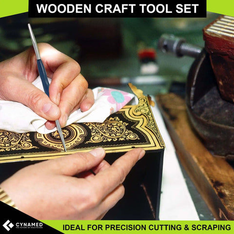 Person using detailed crafting tool on ornate wooden surface, ideal for precision cutting and scraping, close-up view.