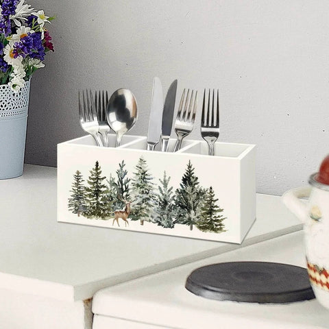 Christmas Tree Wooden Utensils Holder with forest landscape and reindeer, 3-compartments, on white countertop with utensils inside.