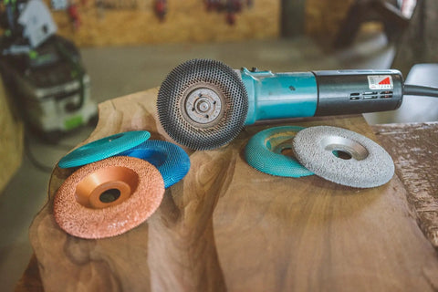Extreme Shaping Disc for Woodworking Coping with Angle Grinder Attachment on a wooden surface with multiple discs