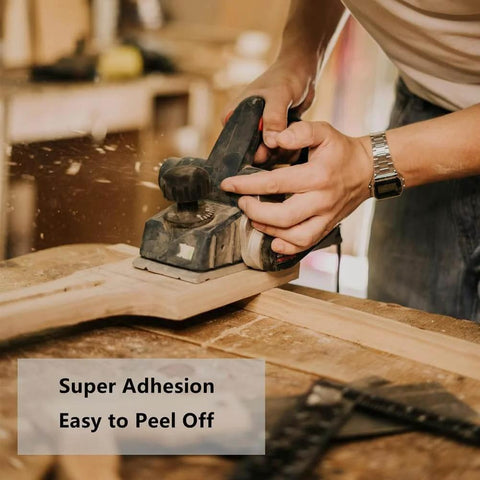Woodworker using Heavy Duty Double Sided Woodworking Tape For Router Templates And CNC Projects 1 Inch By 82 Feet Removable Double Adhesive Tape With Strong Bond And Easy Peel Ideal For Woodworking Setups.