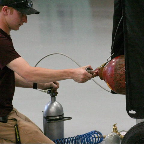Technician using M10 Straight Hydraulic Grease Fittings Pack 20 Pieces Stainless Steel Zerk on industrial machinery.