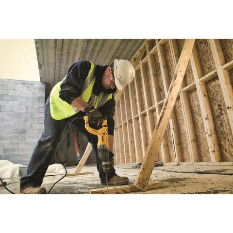 Worker using lightweight corded SDS rotary hammer with Active Vibration Control delivers 3.0 J impact energy and an 8.5 A motor.