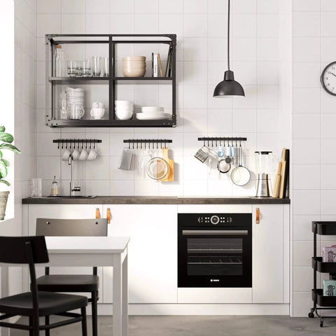 Modern kitchen with white cabinets and a black 17-inch Gourmet Kitchen Rail with 10 hooks for utensils and organization.