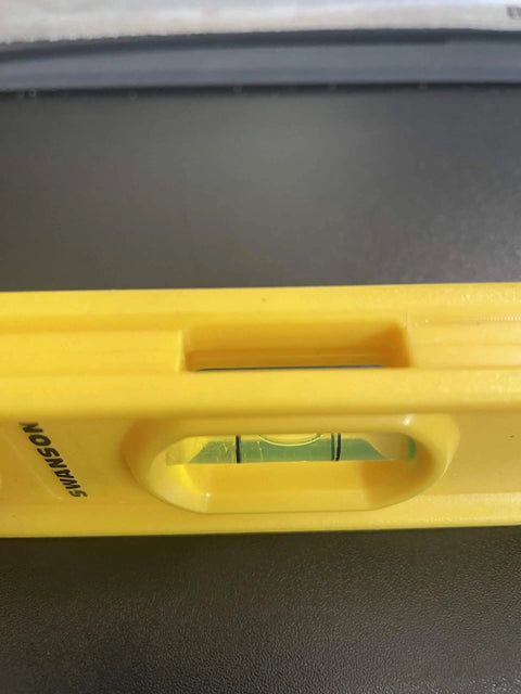 Close-up of Swanson Tool TL011, 9 Inch Speedlite Torpedo Level Yellow Built With High Impact Composite For Tough Jobsite Use Non Conductive Design.