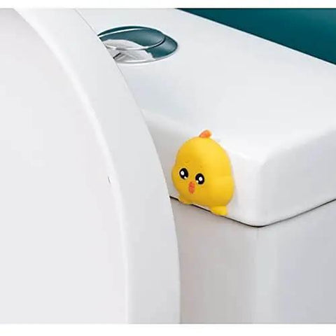 Yellow silicone character stopper installed on a cabinet, part of 10 Pack Doorknob Wall Mute Cushion Silencer For Doors And Cabinets