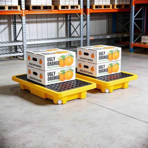 Spill Containment Pallet Set For Two Drums With Drain Outlet in warehouse holding boxes, heavy duty plastic platform, 2000 lbs capacity.