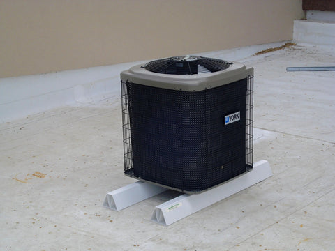 36-inch PVC rooftop support blocks under a York outdoor condenser unit on a flat roof.