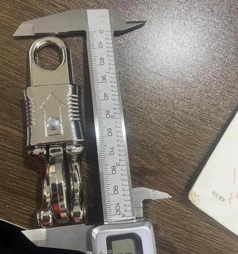 10 Pack Panic Snap Quick Release Metal Snap For Paracord And Get Back Whips With One Half Inch Eye And Quick Detach Clip shown with caliper for size measurement